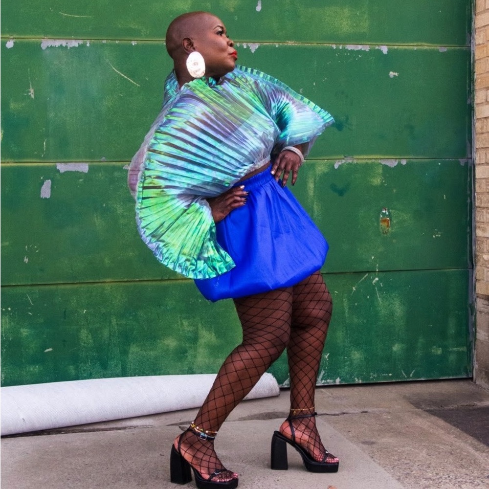 2pcs Set
Vibrant Blue Skirt with Radiant Clamshell  Top